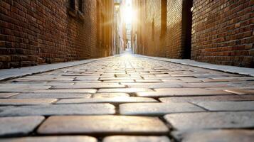serene alleyway with cobblestone pavement, illuminated by sunlight photo