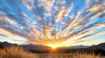 stunning sunset with vibrant orange hues and dramatic clouds photo
