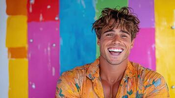 Bright and cheerful man smiling against colorful background photo