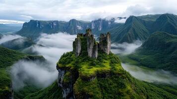 Majestic mountain landscape with fog and rocky formations photo
