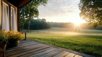 serene sunrise over foggy farm, with sunlight breaking through trees photo