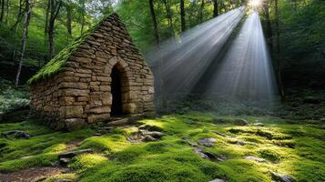 small stone chapel surrounded by lush greenery and sunlight beams photo