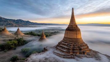 foggy sunrise over ancient temples surrounded by lush greenery evokes tranquility photo