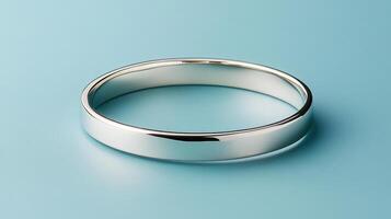 shiny silver bracelet isolated on blue background, showcasing elegance photo