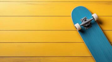 bright blue skateboard on sunny yellow background, perfect for summer fun photo