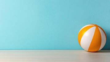 Colorful beach ball on bright turquoise background, perfect for summer fun photo