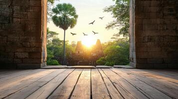 golden sunrise over ancient temple complex with birds flying photo