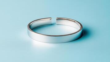 shiny silver bracelet isolated on blue background, showcasing elegance and style photo