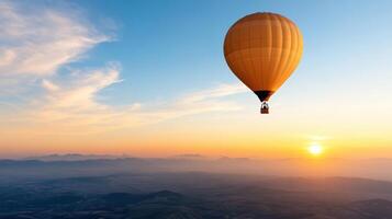 hot air balloon soaring in sky at sunrise, creating serene atmosphere photo