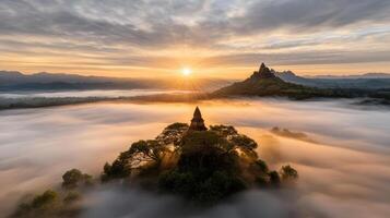 foggy sunrise over forgotten temple surrounded by misty mountains photo