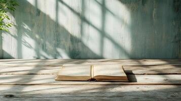 open diary resting on wooden table, illuminated by soft shadows photo