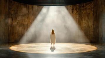 woman stands alone in spotlight on stage, evoking sense of solitude and contemplation photo