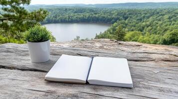 serene landscape featuring open journal on wooden surface, perfect for reflection photo