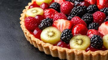 beautifully arranged fruit tart with vibrant berries and glossy finish photo