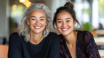 Sharing joyful moment, two women smile brightly together in cozy setting photo