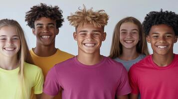Smiling group of young friends in colorful shirts, enjoying their time together photo