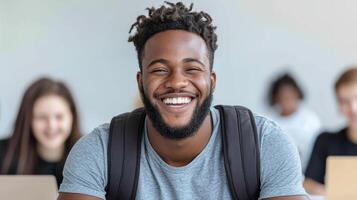 Happy student smiling in classroom with peers working on laptops photo