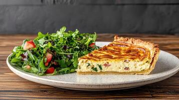 delicious vegetarian quiche served with fresh green salad, perfect for brunch photo