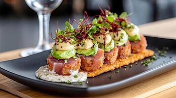 creative ceviche fusion dish featuring tuna, avocado, and garnishes photo
