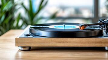 well loved turntable spinning in cozy room with plants nearby photo