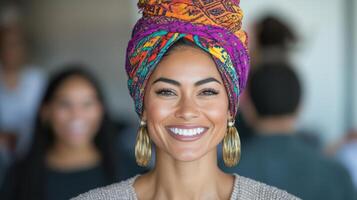 Empowered woman smiling with colorful headwrap and earrings photo