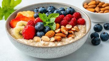 colorful bowl of oatmeal topped with fresh fruits and nuts creates delightful breakfast scene photo