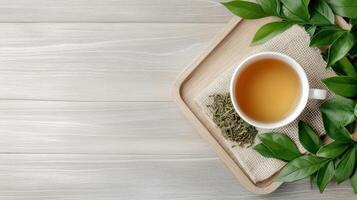 rustic tea setup featuring cup of tea, loose leaves, and fresh green leaves evokes tranquility photo