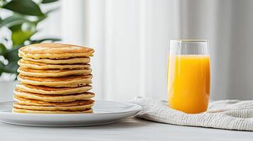 Fluffy pancakes stacked high plate, paired with refreshing glass of orange juice, create photo