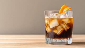 Refreshing cold brew coffee drink with ice and orange garnish photo