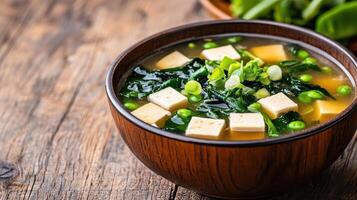 delicious bowl of miso soup with seaweed, tofu, and green onions, perfect for warm meal photo