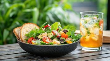 Fresh garden salad with whole grain bread and refreshing drink photo