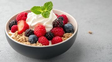 Delicious dessert bowl filled with fresh berries, cream, and crumb topping photo