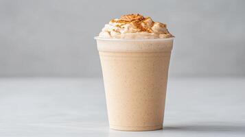 Frothy vanilla protein shake topped with whipped cream and almond butter, perfect for nutritious photo