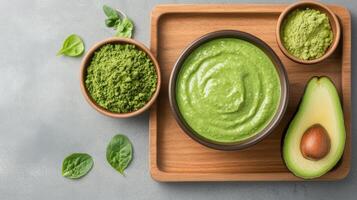 vibrant green smoothie made with avocado, spirulina, and spinach, showcasing healthy ingredients photo