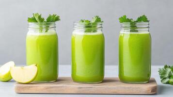 Fresh green juice with apple and herbs in jars photo