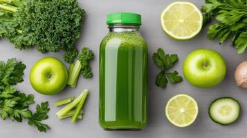 Fresh green juice with kale, celery, and green apples, surrounded by fresh ingredients photo