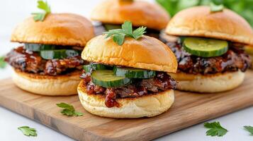 Delicious sliders featuring slow cooked brisket, pickles, and fresh herbs on wooden platter photo
