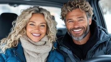 Happy couple smiling inside car, enjoying cozy moment together photo