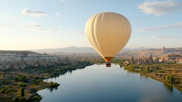 serene hot air balloon floats over picturesque landscape, reflecting on calm lake photo