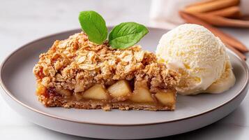 delicious slice of apple crumble topped with oats, served with scoop of creamy ice cream photo