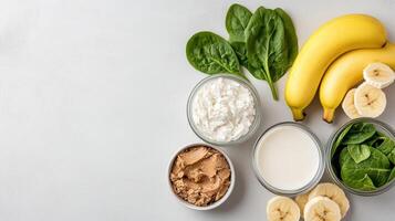 Fresh bananas, spinach, almond butter, and yogurt create vibrant smoothie prep scene photo