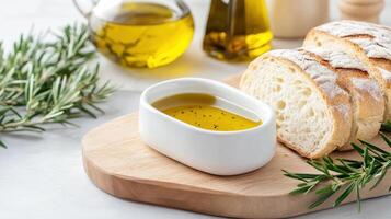 cozy dinner setting featuring dish of olive oil, fresh bread, and herbs evokes warmth and photo