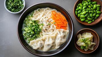 Delicious ramen bowl with gyoza, edamame, and fresh vegetables for satisfying meal photo