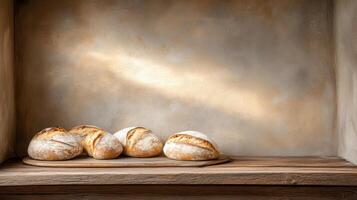 Freshly baked loaves of bread resting on wooden shelf, showcasing rustic charm and warmth photo