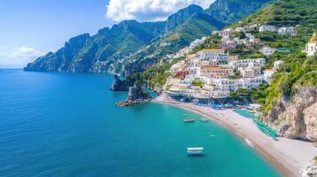 stunning aerial view of Amalfi Coast, showcasing vibrant buildings along shoreline and clear photo