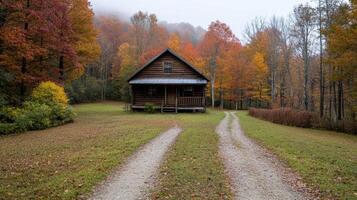 rustic wooden cabin surrounded by vibrant autumn trees creates serene atmosphere photo