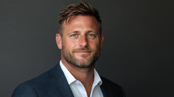 Confident businessman with stylish appearance and friendly smile photo