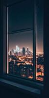 Nighttime urban cityscape view through window with illuminated skyline architecture photo