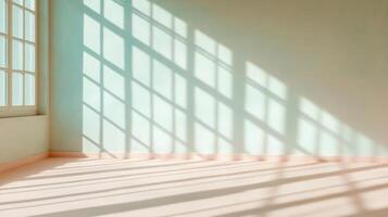 Sunlight streaming through large window casting shadows on pale blue walls in empty room photo
