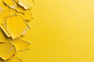 Vibrant yellow paint strokes on canvas creating a bold artistic texture and abstract background photo